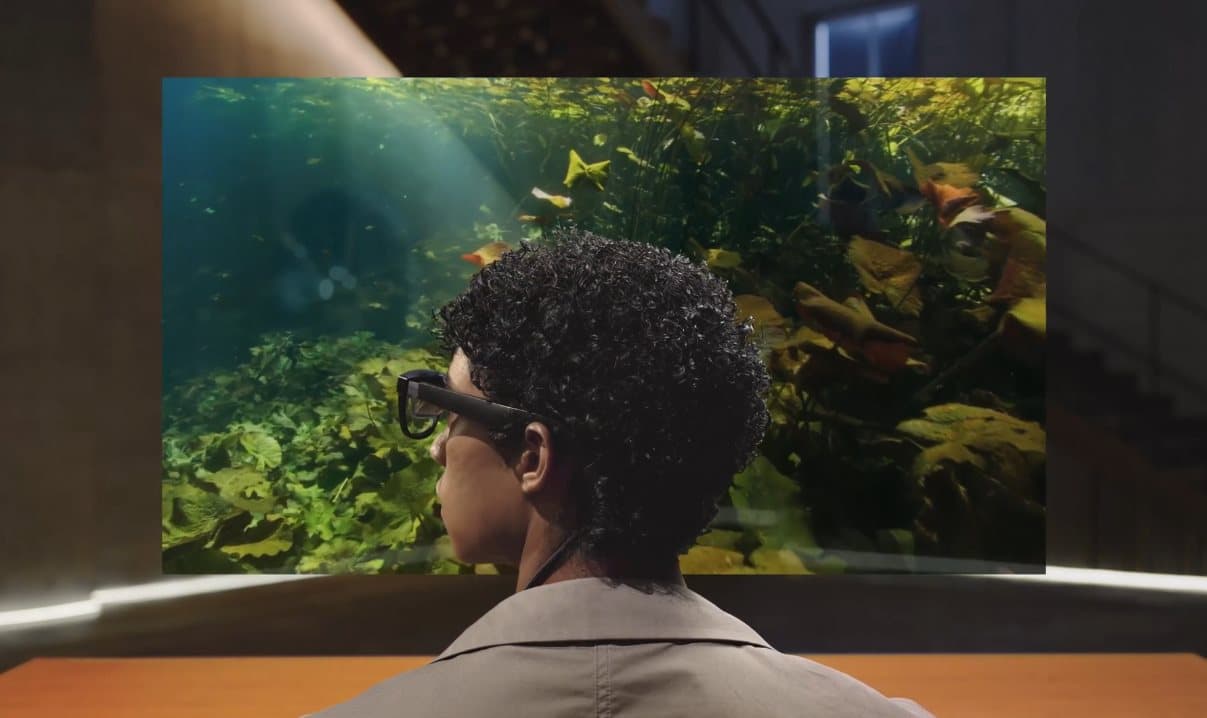XREAL built AR glasses that replace your monitor with a virtual screen the size of a cinema wall. People wear these on planes now.